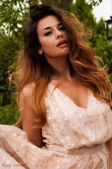 Woman in Lingerie and Heels Strips Nude on a Garden Patio