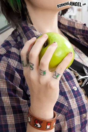 Short-Haired Woman Eats an Apple While Undressing and Spreading