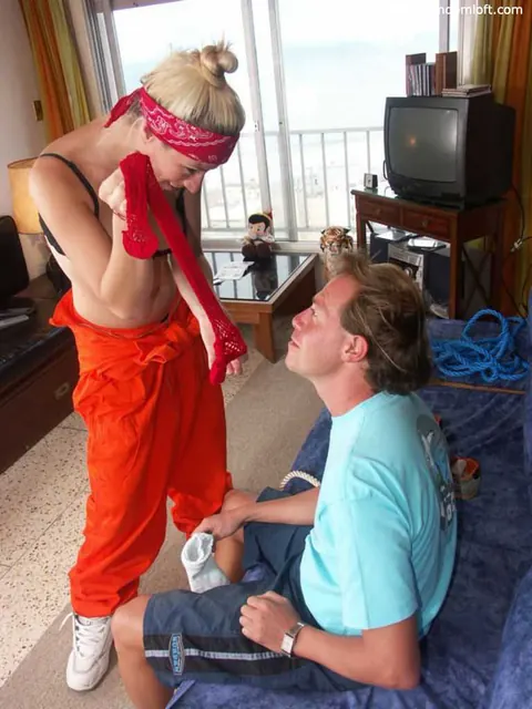 Blonde Dominant Spanks Him with a Wooden Spoon – photo 15 of 16