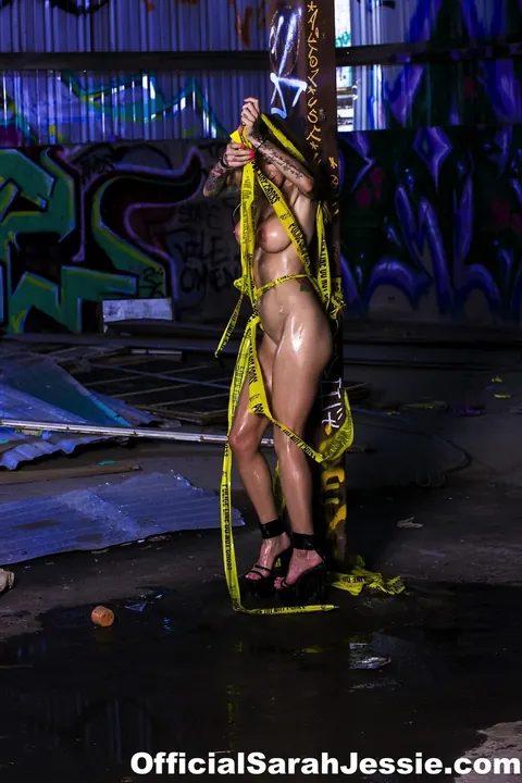 Sarah Jessie: Blonde MILF with Big Tits Bound in Police Tape and Heels – photo 8 of 12