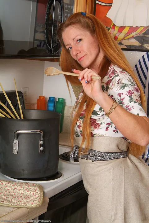 Thick Redhead MILF Strips Out of Her Skirt in the Kitchen – photo 6 of 20