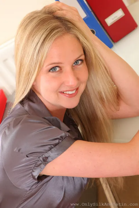 Nikki Friend: Blonde Secretary in Uniform Strips to Lingerie at the Office – photo 3 of 21