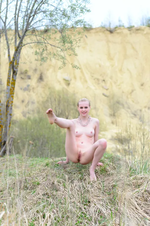 Angelika D: Thick Pale Blonde Spreads Her Hairy Pussy Outdoors by Fire – photo 7 of 16
