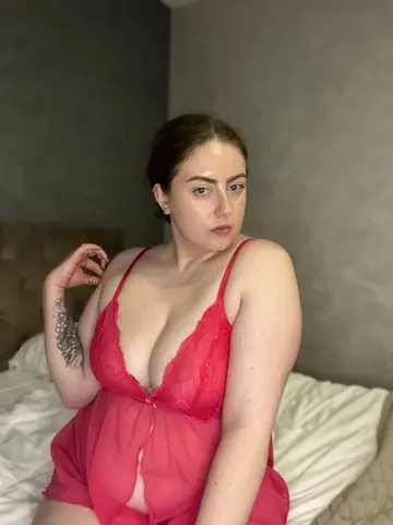 Curvy Tattooed Woman Strips Out of Her Lingerie and Stockings