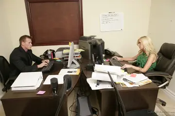 Blonde with Enhanced Tits Gives a Blowjob and Gets Fucked in an Office