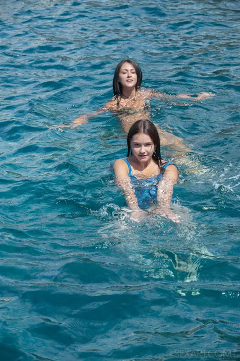 Lana Grand: Two Women in Bikinis Strip Nude on the Rocks After a Swim – photo 2 of 12