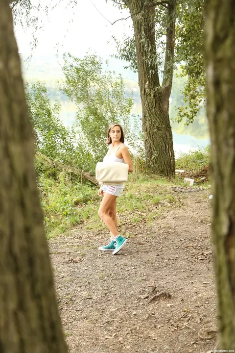 European Babe Undresses and Uses a Dildo in the Forest – photo 1 of 17
