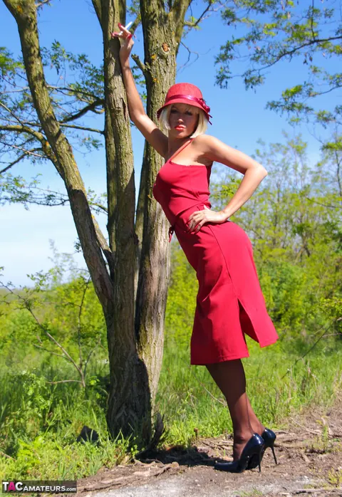 Eva Diangelo: Blonde MILF in Stockings Flashes Her Tits and Ass by a Tree – photo 2 of 16
