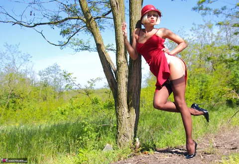 Eva Diangelo: Blonde MILF in Stockings Flashes Her Tits and Ass by a Tree – photo 8 of 16