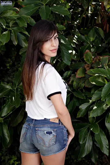 Tattooed Brunette Strips Out of Her Shorts and Spreads Outdoors