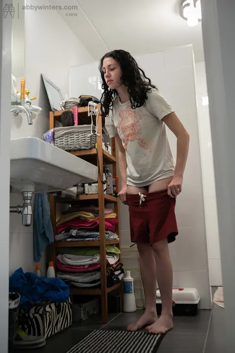 Curly Australian Brunette Shows Her Hairy Bush in the Bathroom – photo 13 of 20