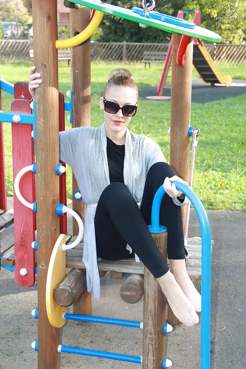 Slim Tall Blonde in Glasses Shows Off Her Long Legs Outdoors – photo 14 of 16