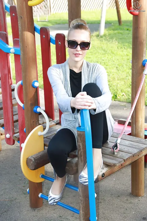 Slim Tall Blonde in Glasses Shows Off Her Long Legs Outdoors – photo 12 of 16