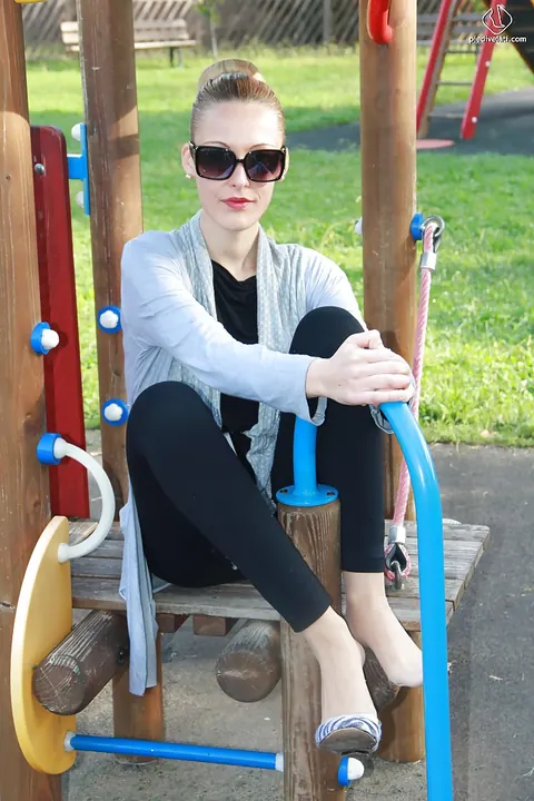 Slim Tall Blonde in Glasses Shows Off Her Long Legs Outdoors – photo 13 of 16
