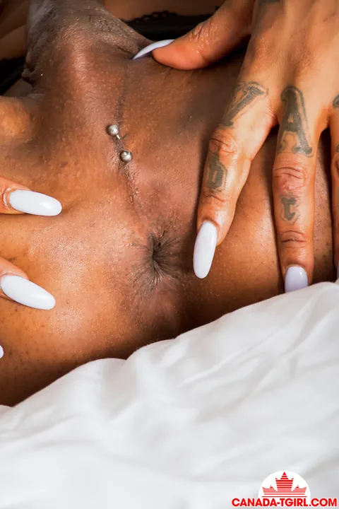Ebony Trans Woman Strips Nude and Flaunts Her Big Tits – photo 13 of 16