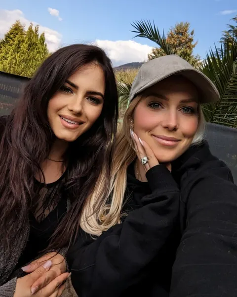 Two Women in Boots Flash Their Asses Outdoors – photo 1 of 15