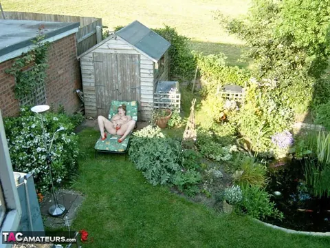 Curvy Claire: Busty Redhead MILF Plays with Her Hairy Pussy on a Backyard Chair – photo 20 of 20