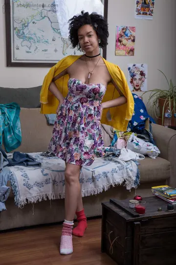 Short-Haired Mature Ebony Woman Spreads in Mismatched Socks