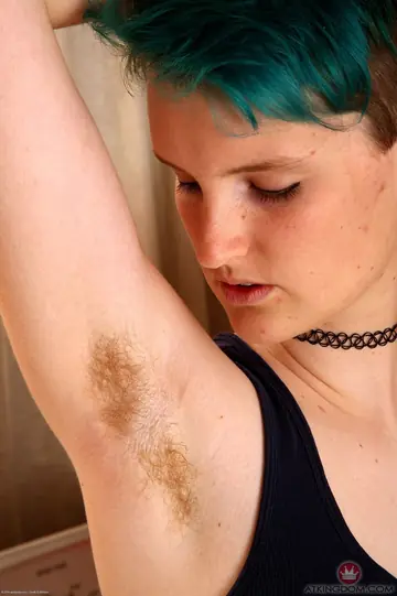 Thick Short-Haired Woman Pulls Down Her Shorts to Show Her Hairy Pussy