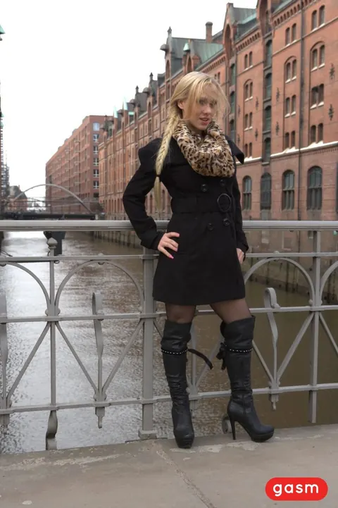 CELINE DAVIS: German Blonde Models a Dress, Stockings and Boots Outdoors – photo 1 of 15
