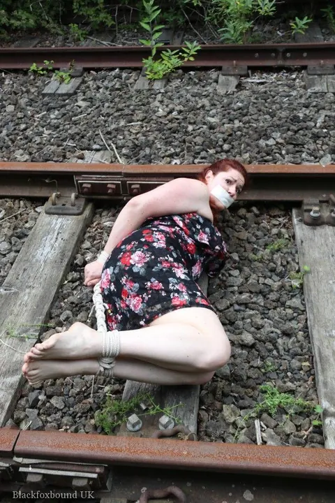 Redhead Bound and Gagged in a Skirt Outdoors – photo 5 of 16