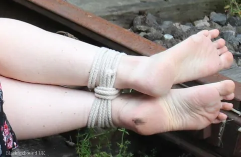 Redhead Bound and Gagged in a Skirt Outdoors – photo 10 of 16