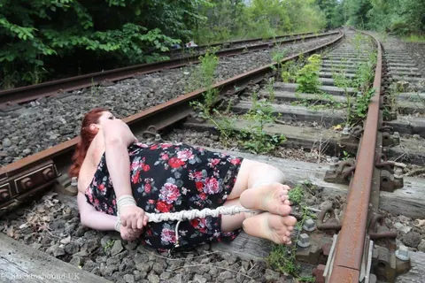Redhead Bound and Gagged in a Skirt Outdoors – photo 6 of 16