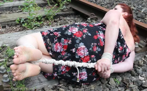 Redhead Bound and Gagged in a Skirt Outdoors – photo 14 of 16