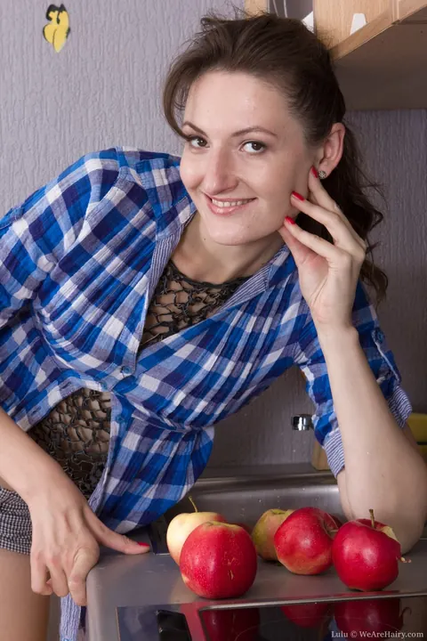 Slim Hairy Brunette Pulls Down Her Shorts in the Kitchen – photo 2 of 17