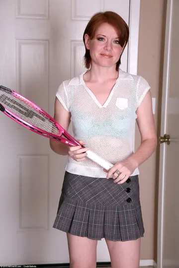 Thick Redhead MILF Strips Out of Her Tennis Skirt to Show Off Her Body