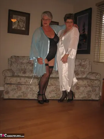 Mature Women in Stockings Share a Strap-On