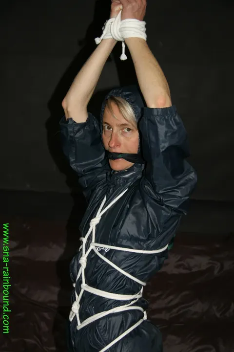 Thick Bound Woman in Rain Gear with Cleave Gag – photo 14 of 16