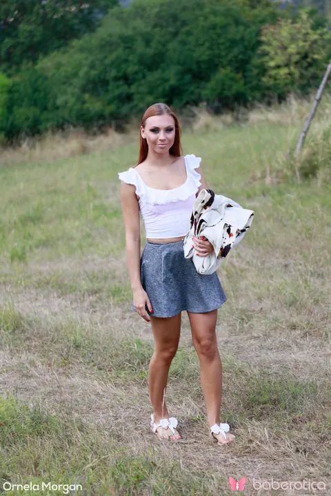 Redhead Strips Out of Her Skirt and Spreads Her Shaved Pussy Outdoors – photo 1 of 15