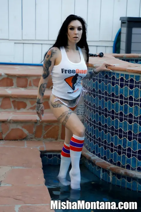 Misha Montana: Busty Tattooed Brunette Spreads Her Pussy Poolside in a Bikini and Socks – photo 10 of 12