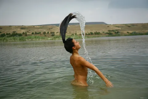 Woman Strips Nude for Erotic Photos – photo 3 of 21