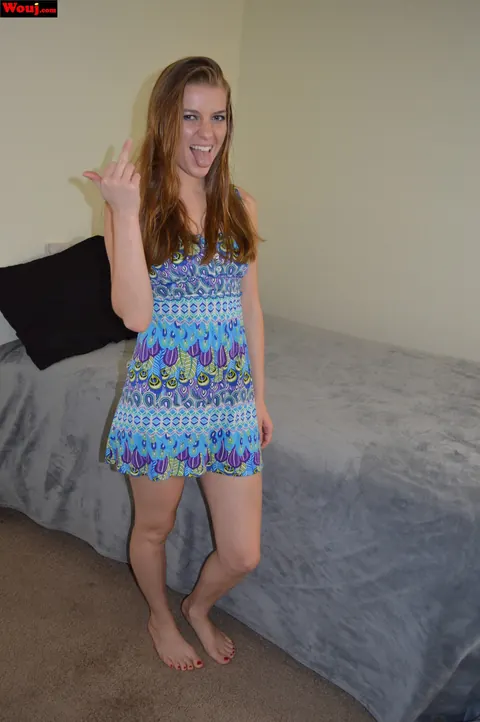 Woman Poses in Clothes and Pulls Her Top Down – photo 14 of 15