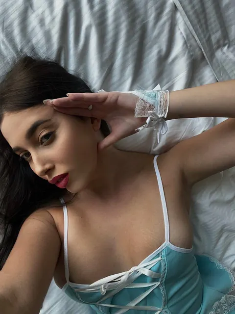 European Brunette Poses in Stockings on the Bed – photo 7 of 14