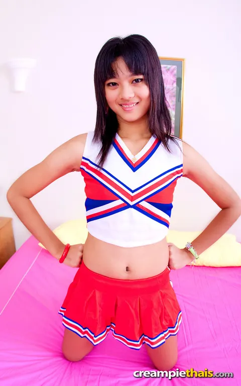 Thai Woman in Uniform Skirt Spreads Her Shaved Pussy – photo 2 of 20