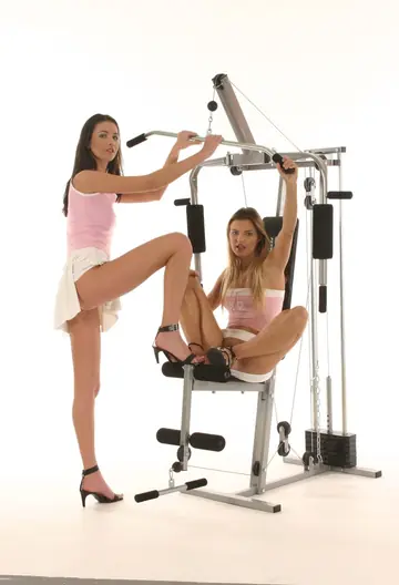 Suzie Carina – Tall Busty Brunette and Partner Strip and Spread on the Gym Equipment