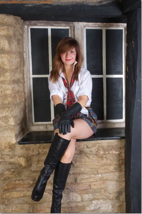 Redhead Exposes Her Ass in Leather Uniform, Boots and High Heels – photo 2 of 15