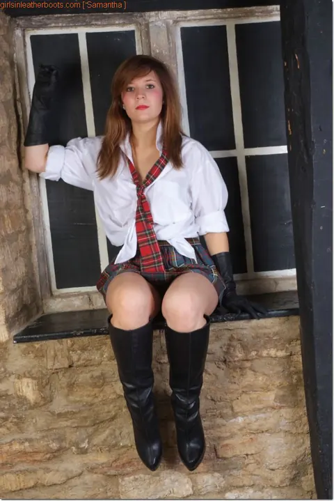Redhead Exposes Her Ass in Leather Uniform, Boots and High Heels – photo 1 of 15