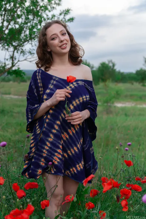 Busty Curly Woman in a Skirt Spreads in the Forest – photo 2 of 21