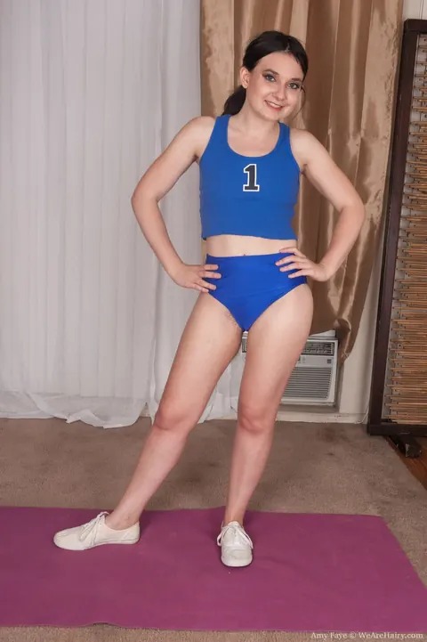 Amy Faye: Petite Brunette Pulls Down Her Shorts and Spreads Her Hairy Pussy in the Gym – photo 2 of 17