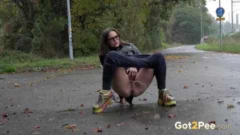 Woman in Glasses Pisses and Spreads on Wet Pavement Outdoors – photo 7 of 15