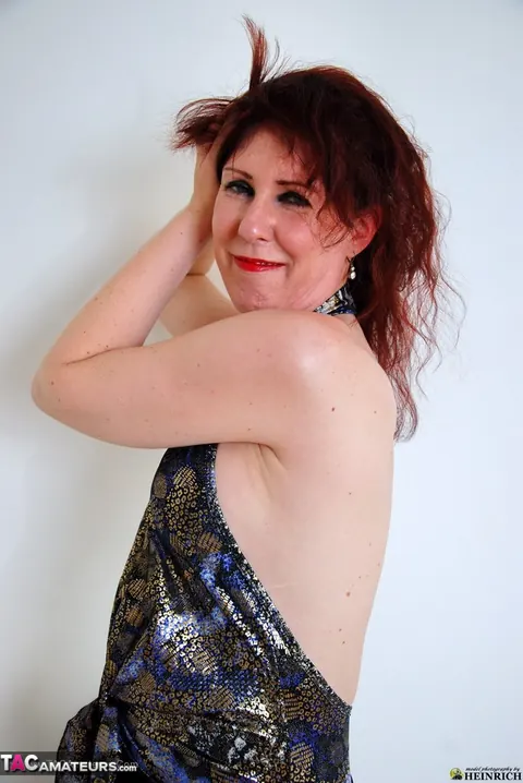 European Redhead MILF Strips Out of Her Skirt and Heels – photo 9 of 20