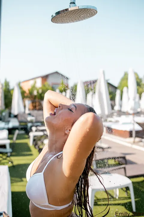 Emilly Starr: Blonde in a Bikini Poses by the Pool Wearing Glasses – photo 1 of 18