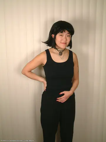 Mature Asian Woman Undresses and Spreads Her Hairy Pussy