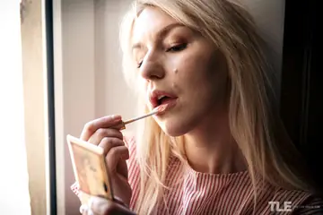 Blonde in Stockings Fingers Her Shaved Pussy and Fucks a Dildo