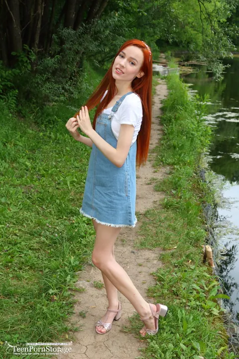 Slim Redhead Lifts Her Skirt and Spreads Outdoors – photo 1 of 20