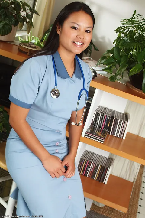 Asian Nurse Strips Out of Her Uniform and Spreads Her Shaved Pussy – photo 1 of 16